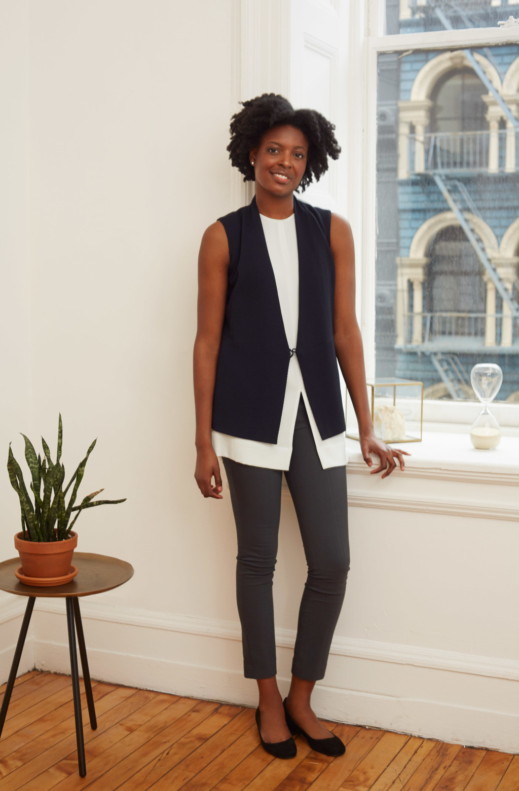 Pauline wears the Cassatt vest in ripple over the Coppola top with the Foster pant in monsoon.