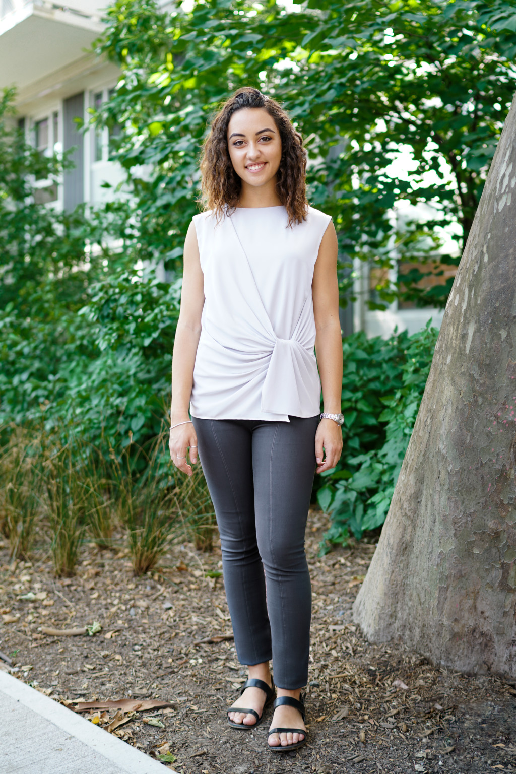 Elle wears the Foster pant in monsoon, the Bronte top in mist, and the Tennis bracelet